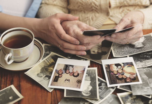 Senior woman and granddaughter sitting at table