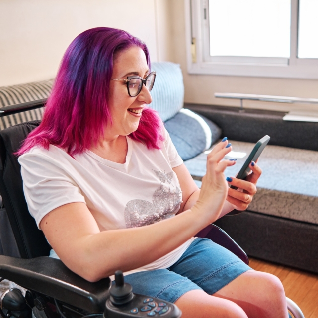 Adult woman using smartphone at home