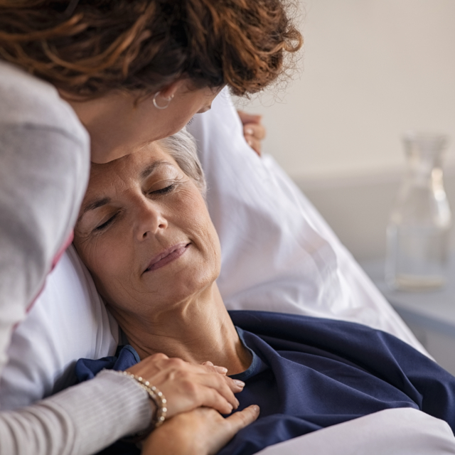 Woman kissing her mother at hospital 2023 11 27 05 35 35 utc