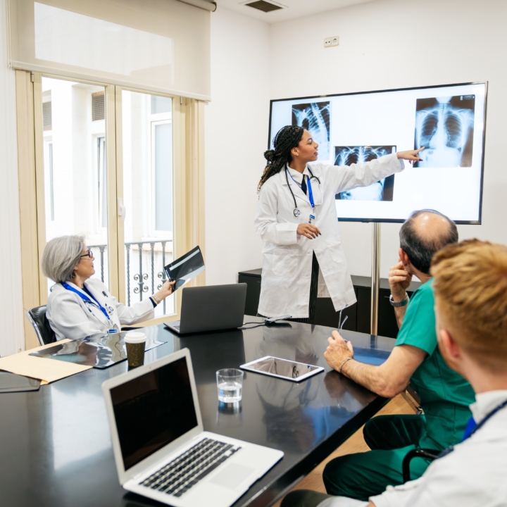 Medical team collaborating on radiology x rays in 2026 06 22 16 53 36 utc